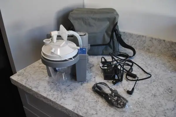 The DeVilbiss 7305P-D Vacu-Aide homecare suction unit