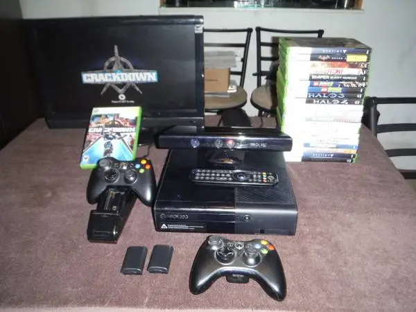 XBOX 360/23 games/guitar/controllers/charging cradle/kinect/dvd remote