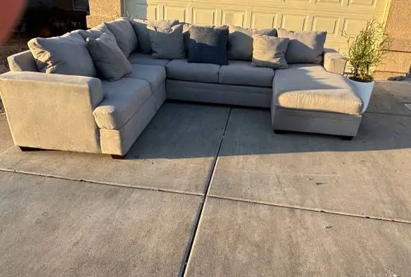 GRAY REVERSIBLE CHAISE SECTIONAL BY LIVING SPACES , DELIVERY INCLUDED