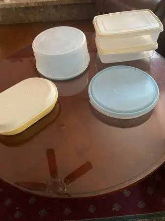 Tupperware containers, for storage and a large round one is for cakes,