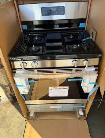 New GE stainless steel gas stove and oven