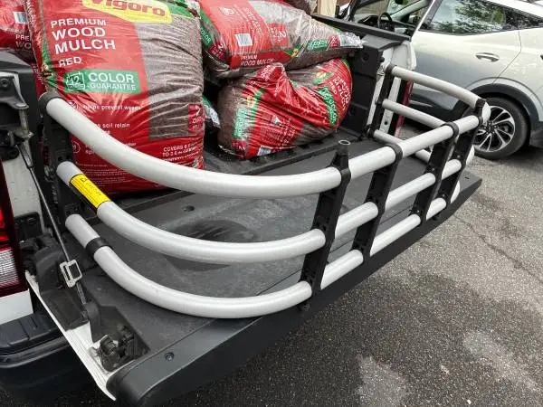 TRUCK BED EXTENDER IN NEW CONDITION NO HARDWARE JUST USED 2 BUNGEES