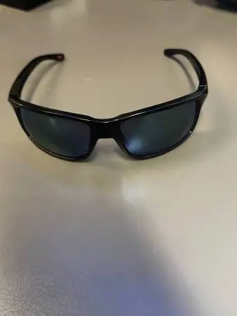 Oakley Gibston sunglasses, model OO9449-1560. This is a popular sporty