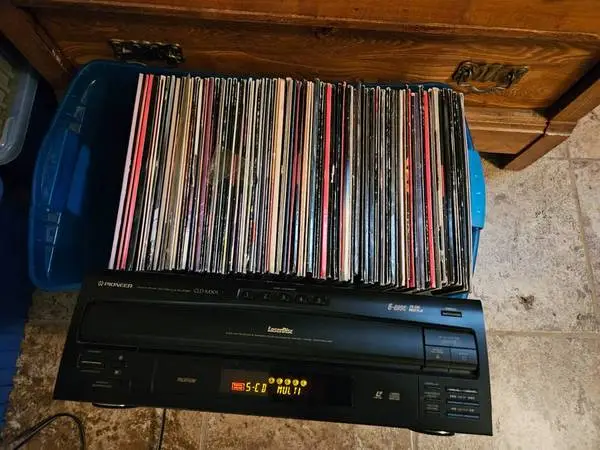 Pioneer laser disc player and 75 movies