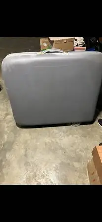Massage table with adjustable arm and headrest. Portable.