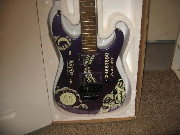 NEW LISTING...PURPLE OUIJABOARD GUITAR ...NEW IN BOX..ONLY $350