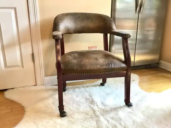 Conference chair with accent nail trim and casters
