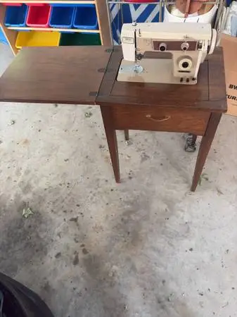 Sewing machine with cabinet