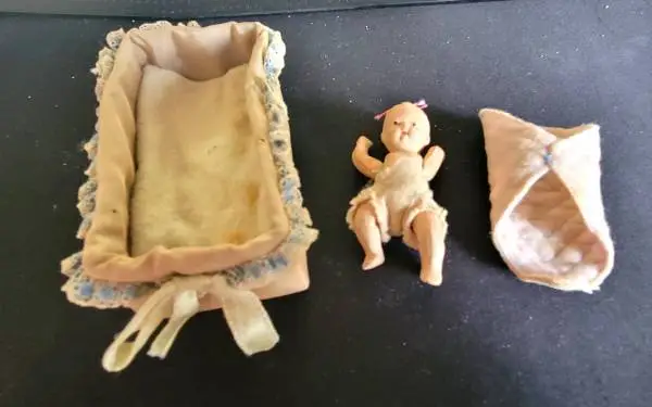***Very Vintage Japan Jointed Porcelain Baby Doll  Taffeta Cradle