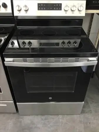 Like new General Electric 5 burner Glass top stove