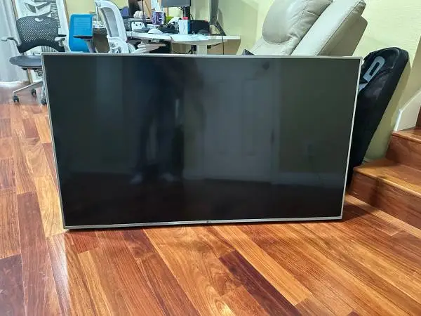 LG 55-inch TV with wall mount