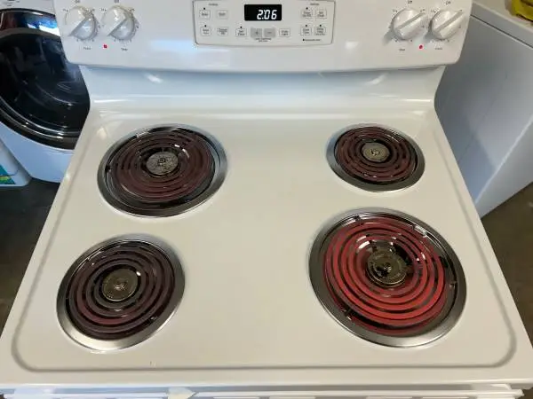 Almost New White GE electric stove 30” Width