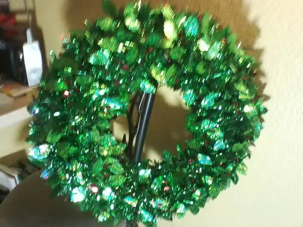 Green Wreath with red berries on steel frame. Like new!