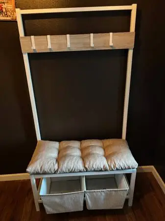 Entry bench with coat hangers