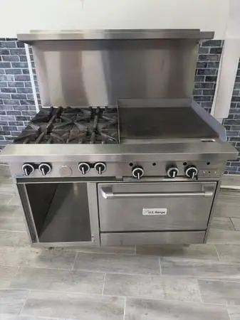 Commercial stove with 4 burners and 2 foot griddle and oven wit
