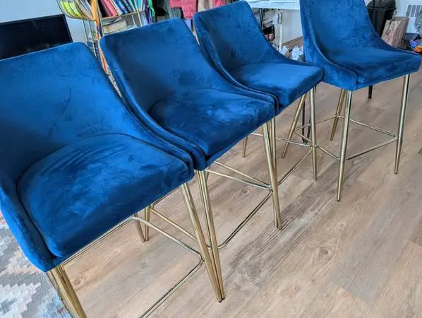 Set of four contemporary blue suede and gold chairs