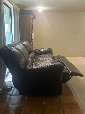 Black leather reclining couch
