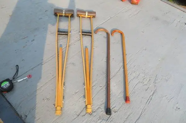 PAIR OF WOODEN CRUTCHES (LIKE NEW) and TWO WOODEN CANES