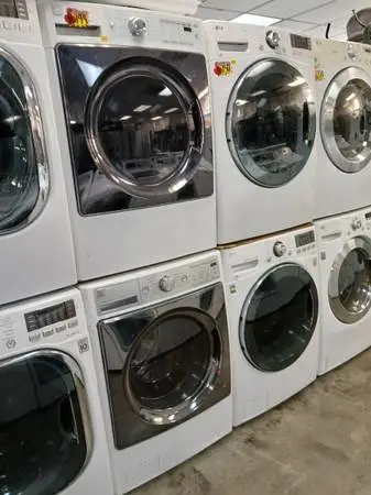 White Kenmore elite steam front load washer and gas dryer