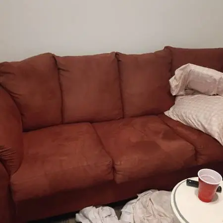 Comfy red sleeper couch in excellent condition. 125