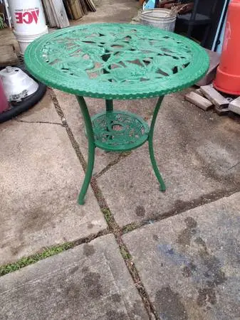 Cast iron bistro table with roses pattern