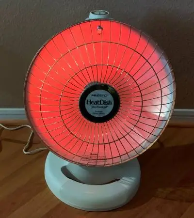 Presto parabolic electric dish heater with foot light