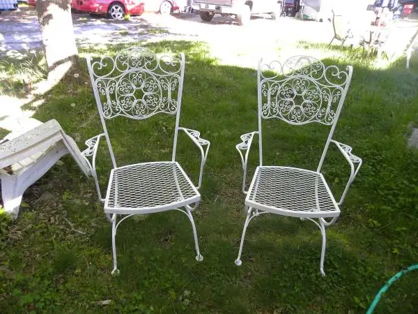 Two wrought iron chairs