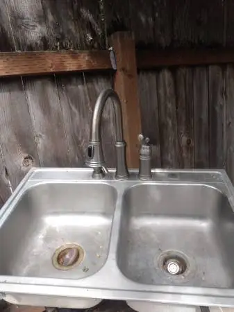 Stainless steel sink with faucet was asking. $100 now
