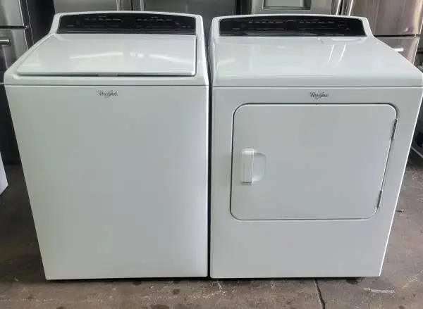 Whirlpool super capacity top loading washer and dryer.