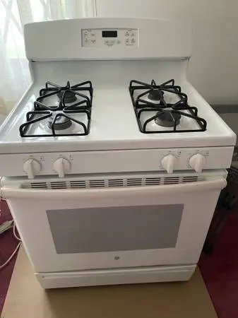 #### WHITE GE STOVE WITH SELF CLEANING ####