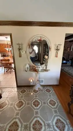 Marbelized pink and cream podium table and matching mirror