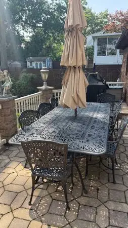 Outdoor cast aluminum table chairs and unbrella