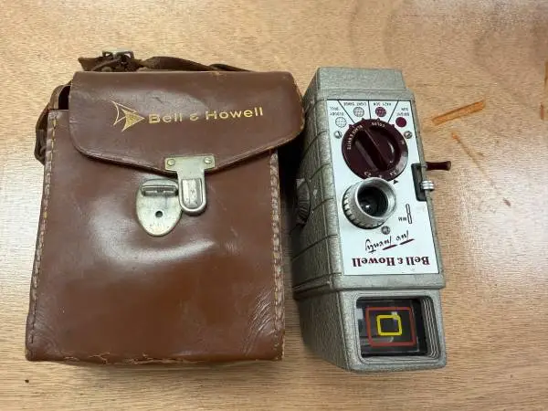 Vintage Bell & Howell Camera and Case, typically from the 1950s or 196