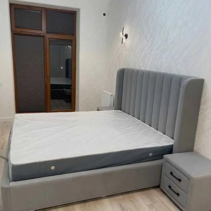 Grey Upholstered Vertical Channel Tufted Wingback Bed