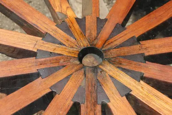 Teak Cartwheel table with glass top