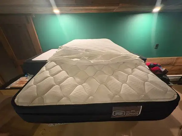 Two like-new twin mattress/box springs, also king metal platform for