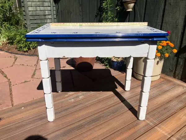 Vintage expanding blue and white enamel top table with wooden base