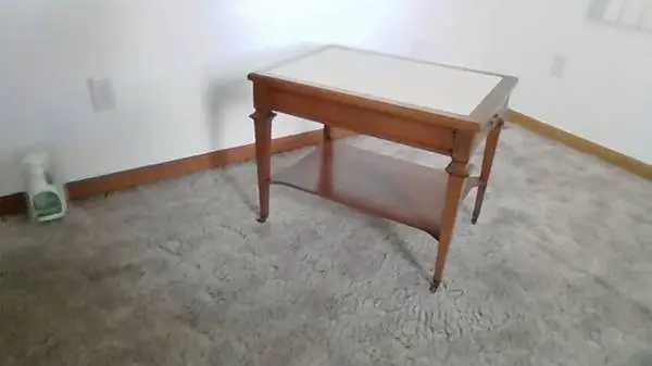 end table wood with Mable top and nice drawer and little wheels