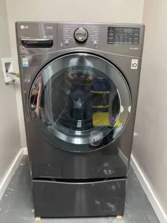 LG Washer and Dryer combo with storage pedestal