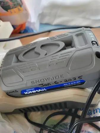 Battery and Charger for a Snow Joe Electric Snow Blower. Plus 1 Extra.