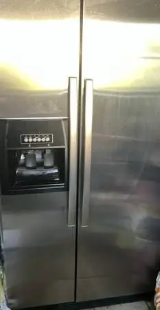 Matching Stainless Steel Whirlpool Gas Stove and Fridge