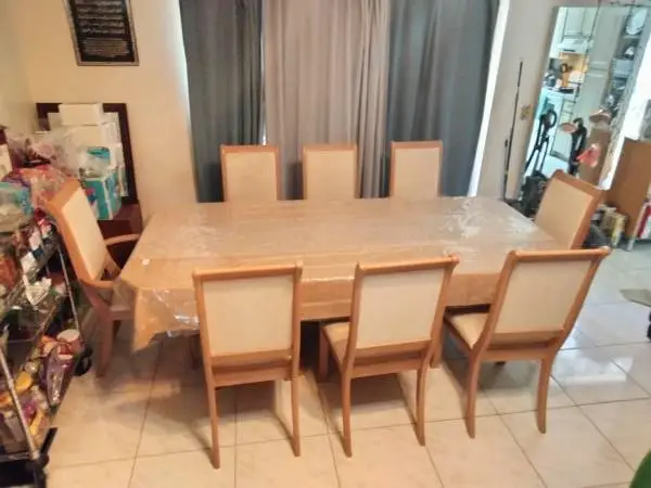 Wooden Dinning table with eight chairs