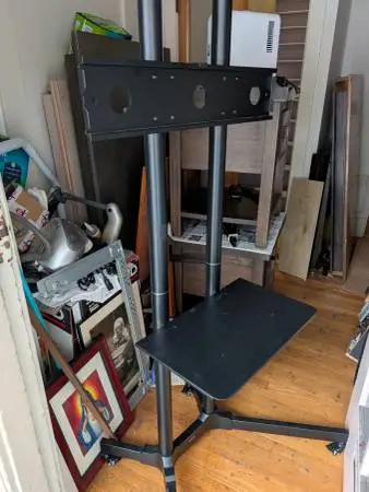 Heavy duty metal rolling TV stands in excellent condition