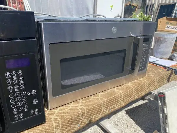 SS GE Microwave Oven Steam Clean Model #JVM7195SK6SS Used