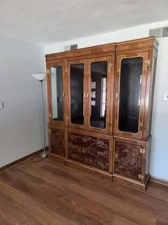 Asian style china cabinet & Queen embroidered armchair