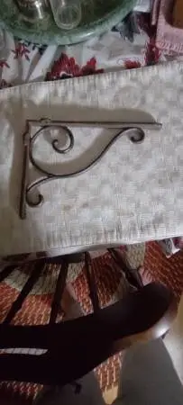 Set of two vintage cast iron shelf brackets