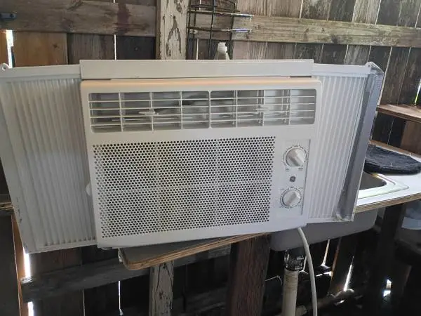 A portable GE 5,000 BTU 115V Window Air Conditioner & Dehumidifier