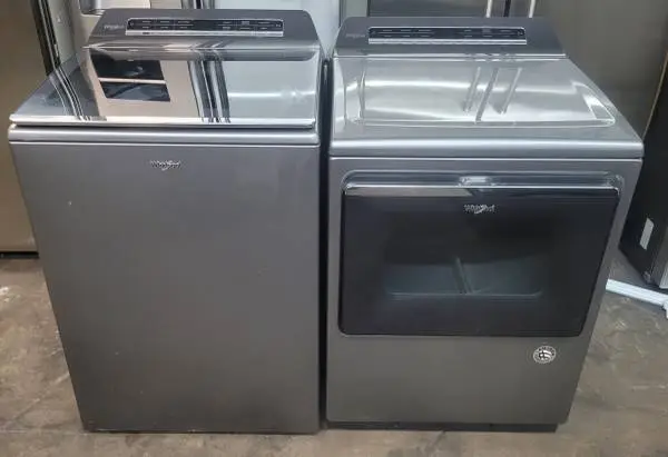 Whirlpool super capacity top loading washer and dryer, like new.