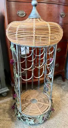 vintage wrought iron and wicker birdcage-style wine rack