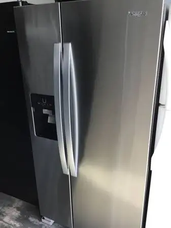 Stainless steel Whirlpool refrigerator side by side